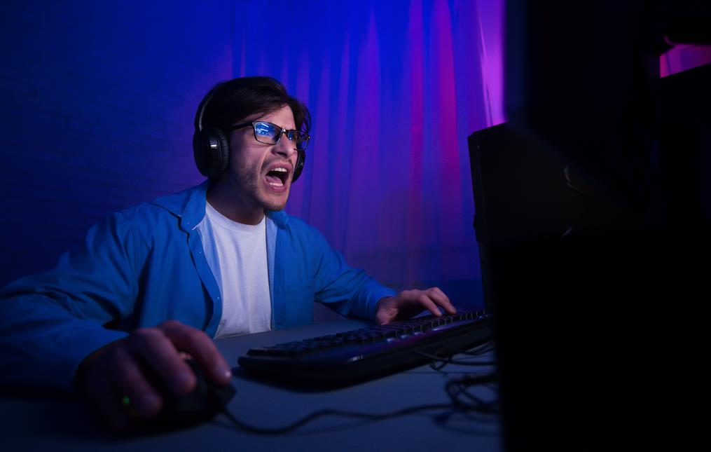 emotional-gamer-playing-video-game-online-and-shou-KNNTKJG.jpg